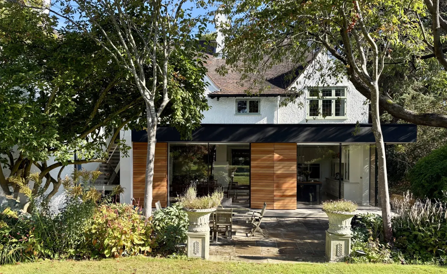 Hoban Design residential architecture, framed by mature trees